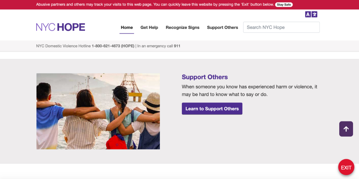 A webpage displays a picture of a group of people linking arms
